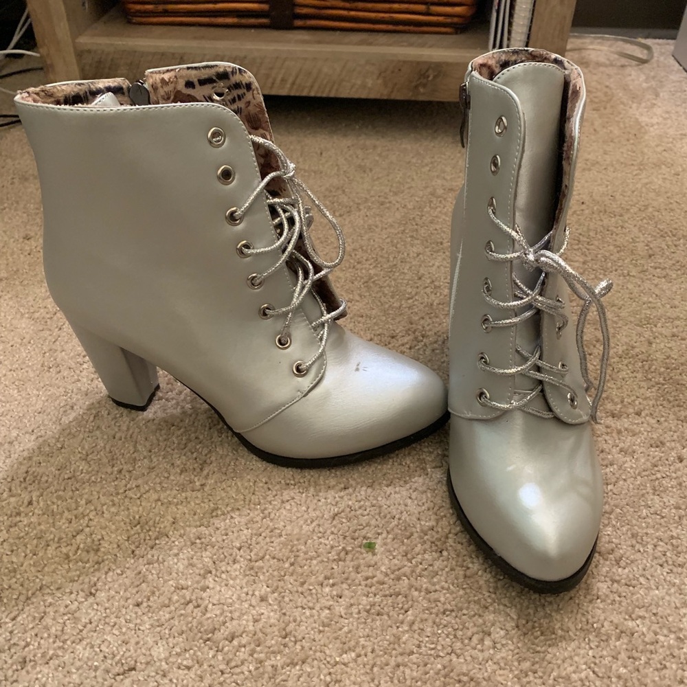 Brand new never been worn silver heeled boots